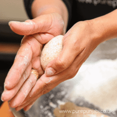 Rolling out the rotis into pere (rounds) How to make Roti step-by-step from scratch with Pure Punjabi at Pure Punjabi Indian experience cookery workshop